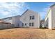 View of the home's backyard and back exterior at 7214 Fox Point Dr, Charlotte, NC 28269