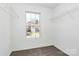 A bedroom with natural light and closet organizers at 7214 Fox Point Dr, Charlotte, NC 28269