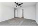 An open bedroom with gray carpet, white walls, and doorway at 7214 Fox Point Dr, Charlotte, NC 28269