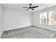 A bright bedroom is illuminated by natural light streaming through two windows at 7214 Fox Point Dr, Charlotte, NC 28269