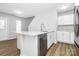 Bright kitchen features granite countertops, stainless appliances, and hardwood floors, and white cabinets at 7214 Fox Point Dr, Charlotte, NC 28269