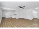 Spacious living room with luxury vinyl plank flooring, modern ceiling fan and recessed lighting creates a cozy atmosphere at 7214 Fox Point Dr, Charlotte, NC 28269