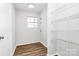 Walk-in pantry with new vinyl plank flooring, wire shelving and natural light at 7214 Fox Point Dr, Charlotte, NC 28269