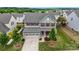 Lovely home has a well-manicured lawn, and an attached two-car garage with neighborhood views at 7263 Waterwheel Sw St, Concord, NC 28025