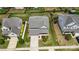 Aerial view of the home and landscaped front yard, showcasing its curb appeal and garage at 7263 Waterwheel Sw St, Concord, NC 28025