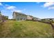 Spacious backyard with a patio set perfect for outdoor dining and entertaining at 7263 Waterwheel Sw St, Concord, NC 28025