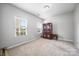 Inviting bedroom with neutral walls and carpet, offering a cozy and relaxing atmosphere at 7263 Waterwheel Sw St, Concord, NC 28025