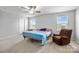 Bright and spacious bedroom with carpeted floor and a ceiling fan at 7263 Waterwheel Sw St, Concord, NC 28025