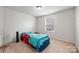Unique car-themed bed adds fun to this bedroom, complemented by a bright window at 7263 Waterwheel Sw St, Concord, NC 28025