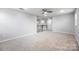 Large bonus room with carpeted floors and lots of natural light at 7263 Waterwheel Sw St, Concord, NC 28025