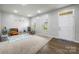 Bright bonus room offers carpet flooring, recessed lighting, and ample natural light at 7263 Waterwheel Sw St, Concord, NC 28025