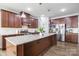 Updated kitchen featuring an island, stainless steel appliances and granite counters at 7263 Waterwheel Sw St, Concord, NC 28025
