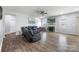Bright living room boasts hardwood flooring, a cozy fireplace, and plenty of natural light at 7263 Waterwheel Sw St, Concord, NC 28025