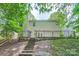 A beautifully landscaped backyard features stone steps leading to an upper level at 7810 Leisure Ln, Huntersville, NC 28078