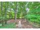 Picturesque backyard featuring a stone pathway and a charming fire pit area at 7810 Leisure Ln, Huntersville, NC 28078