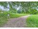 Scenic community grounds with walking path, volleyball court and lush landscaping at 7810 Leisure Ln, Huntersville, NC 28078