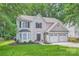 Charming two-story home featuring a two-car garage and well-manicured lawn at 7810 Leisure Ln, Huntersville, NC 28078