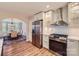 Well-lit kitchen featuring stainless steel appliances and an open view to the dining room at 7810 Leisure Ln, Huntersville, NC 28078
