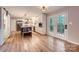 Spacious kitchen boasts stainless appliances, white cabinets, a center island, and access to the backyard through french doors at 7810 Leisure Ln, Huntersville, NC 28078