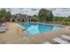 Community pool area with ample seating and umbrella-shaded tables at 7810 Leisure Ln, Huntersville, NC 28078