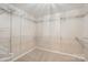 Spacious walk-in closet with ample shelving and rod space for organized storage at 7810 Leisure Ln, Huntersville, NC 28078