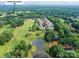 Beautiful aerial view of a home located on a golf course with easy access to Cedarwood Country Club at 8026 Greenview Terrace Ct, Charlotte, NC 28277