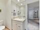 Well-lit powder room featuring a stylish vanity, mirror, and neutral decor at 8026 Greenview Terrace Ct, Charlotte, NC 28277