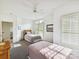 Bright bedroom with twin beds, plantation shutters, and neutral decor create a serene atmosphere at 8026 Greenview Terrace Ct, Charlotte, NC 28277