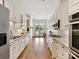 Bright kitchen featuring granite countertops, stainless steel appliances, and hardwood flooring at 8026 Greenview Terrace Ct, Charlotte, NC 28277