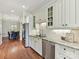 Charming kitchen featuring granite countertops, stainless steel appliances, and hardwood flooring at 8026 Greenview Terrace Ct, Charlotte, NC 28277