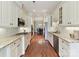 Modern kitchen featuring stainless steel appliances, granite countertops and hardwood flooring at 8026 Greenview Terrace Ct, Charlotte, NC 28277