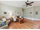 Comfortable living room with hardwood floors, neutral colors, and ample natural light at 8026 Greenview Terrace Ct, Charlotte, NC 28277