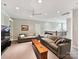 Expansive living room boasts neutral decor, plush carpet, and abundant natural light at 8026 Greenview Terrace Ct, Charlotte, NC 28277
