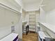 Organized walk-in closet with shelving and storage solutions at 8026 Greenview Terrace Ct, Charlotte, NC 28277