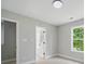 Neutral color palette bedroom with carpeted floors, white trim, and a window at 8304 Prescott Glen Pkwy, Waxhaw, NC 28173