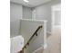 Hallway with access to the stairway and doors, offering convenient navigation throughout the home at 8304 Prescott Glen Pkwy, Waxhaw, NC 28173
