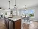 Well-lit kitchen featuring wood cabinets, stainless steel appliances, and a cozy breakfast nook at 8304 Prescott Glen Pkwy, Waxhaw, NC 28173