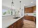 Spacious kitchen with wood cabinetry, stainless steel appliances, and a bright breakfast bar at 8304 Prescott Glen Pkwy, Waxhaw, NC 28173