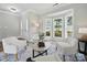 Welcoming living room with a bay window, hardwood floors, neutral paint and an open doorway at 8304 Prescott Glen Pkwy, Waxhaw, NC 28173