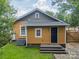 Cozy backyard featuring a small deck, steps, and grassy area, ideal for relaxing and outdoor enjoyment at 904 Anderson St, Charlotte, NC 28205