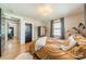 Comfortable bedroom features decor lighting, rug and decorative pillows at 904 Anderson St, Charlotte, NC 28205