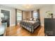 Charming bedroom with hardwood floors, metal bed frame, and lots of natural light at 904 Anderson St, Charlotte, NC 28205