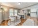 Bright dining area adjacent to kitchen, featuring a round table and stylish seating at 904 Anderson St, Charlotte, NC 28205