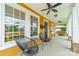 Spacious porch with chairs and ceiling fans, perfect for relaxing outdoors at 904 Anderson St, Charlotte, NC 28205