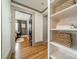 Hallway with open bedroom view and shelving featuring decorative baskets and linens at 904 Anderson St, Charlotte, NC 28205
