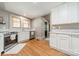 Charming kitchen with white cabinets, stainless steel appliances, and hardwood floors at 904 Anderson St, Charlotte, NC 28205