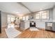 Bright kitchen with white cabinets, stainless steel appliances, and hardwood floors with an open layout at 904 Anderson St, Charlotte, NC 28205