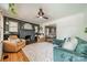 Cozy living room with a stone fireplace, plush seating, and hardwood floors at 904 Anderson St, Charlotte, NC 28205