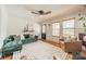 Comfortable living room featuring a green sofa, stylish furniture, and ample natural light at 904 Anderson St, Charlotte, NC 28205