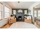 Inviting living room with stone fireplace, hardwood floors, and plenty of natural light at 904 Anderson St, Charlotte, NC 28205